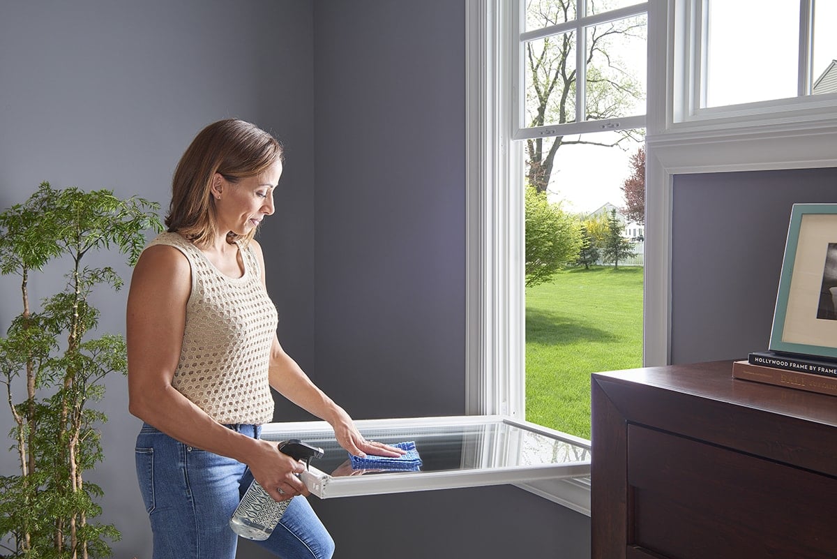 woman cleaning window