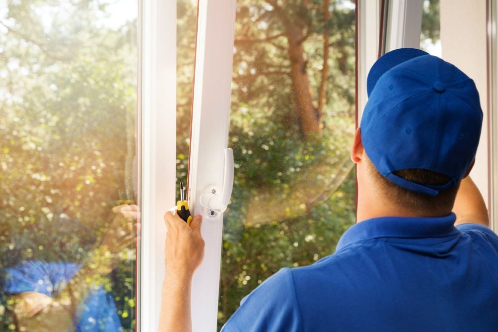 man installing a window